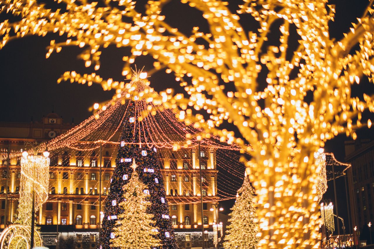 Vibrant display of Christmas lights and decorations at night creating a festive atmosphere.