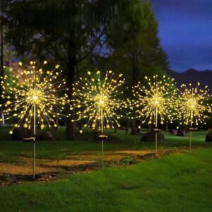 Solar firework lights glowing at night in garden